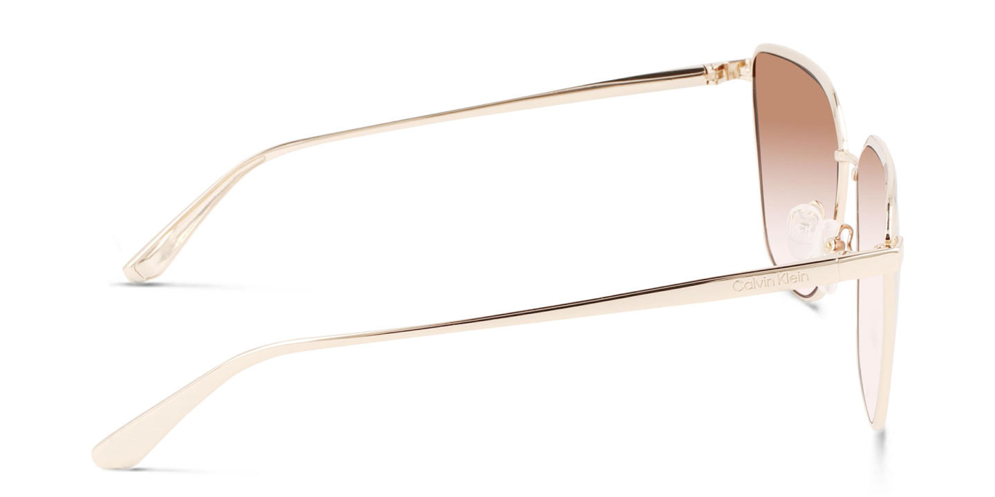 Shop Calvin Klein Square Sunglasses in Gold online.