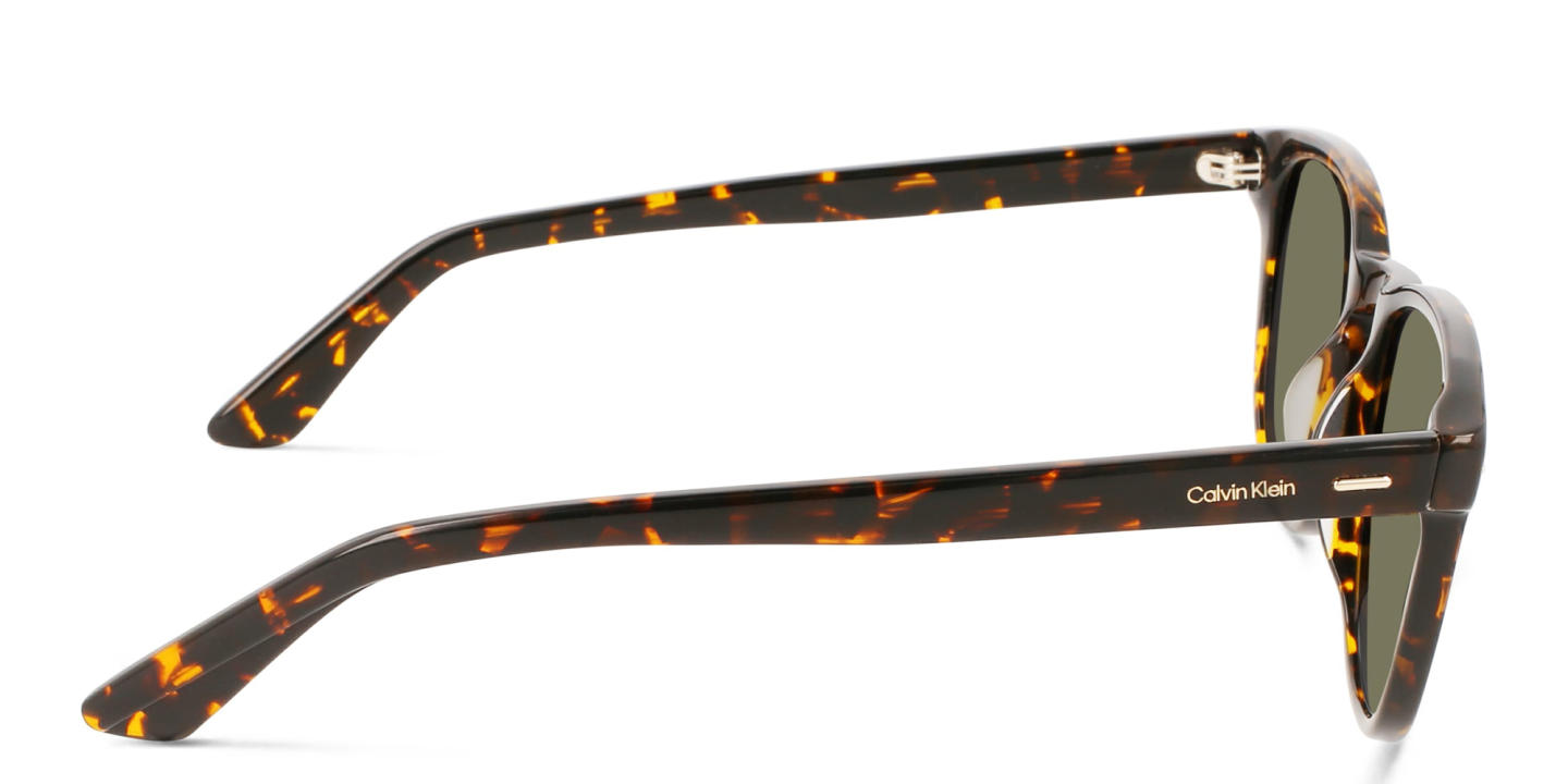 Shop Calvin Klein Unisex Round Sunglasses in Brown online.