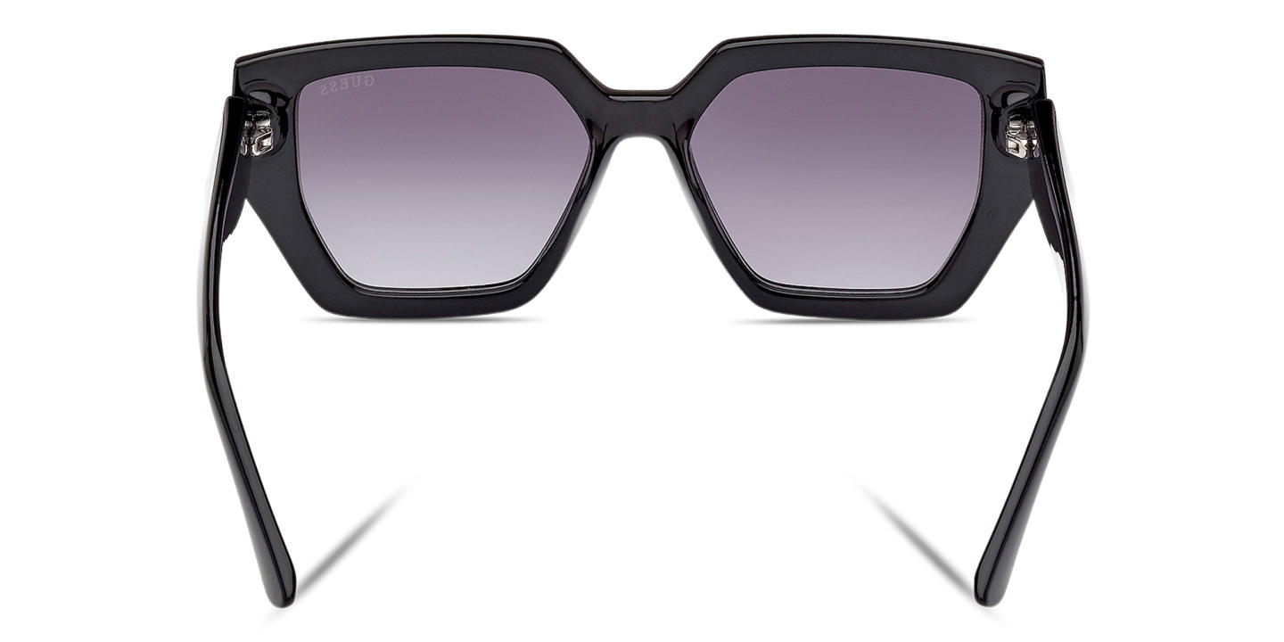Shop Guess Irregular Sunglasses in Black online.