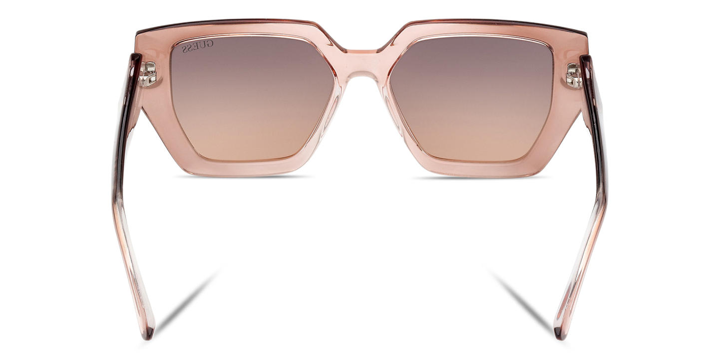 Shop Guess Irregular Sunglasses in Brown online.