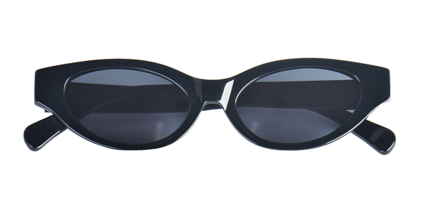 Shop Karen Wazen Glamorous Oval Sunglasses in Black online.