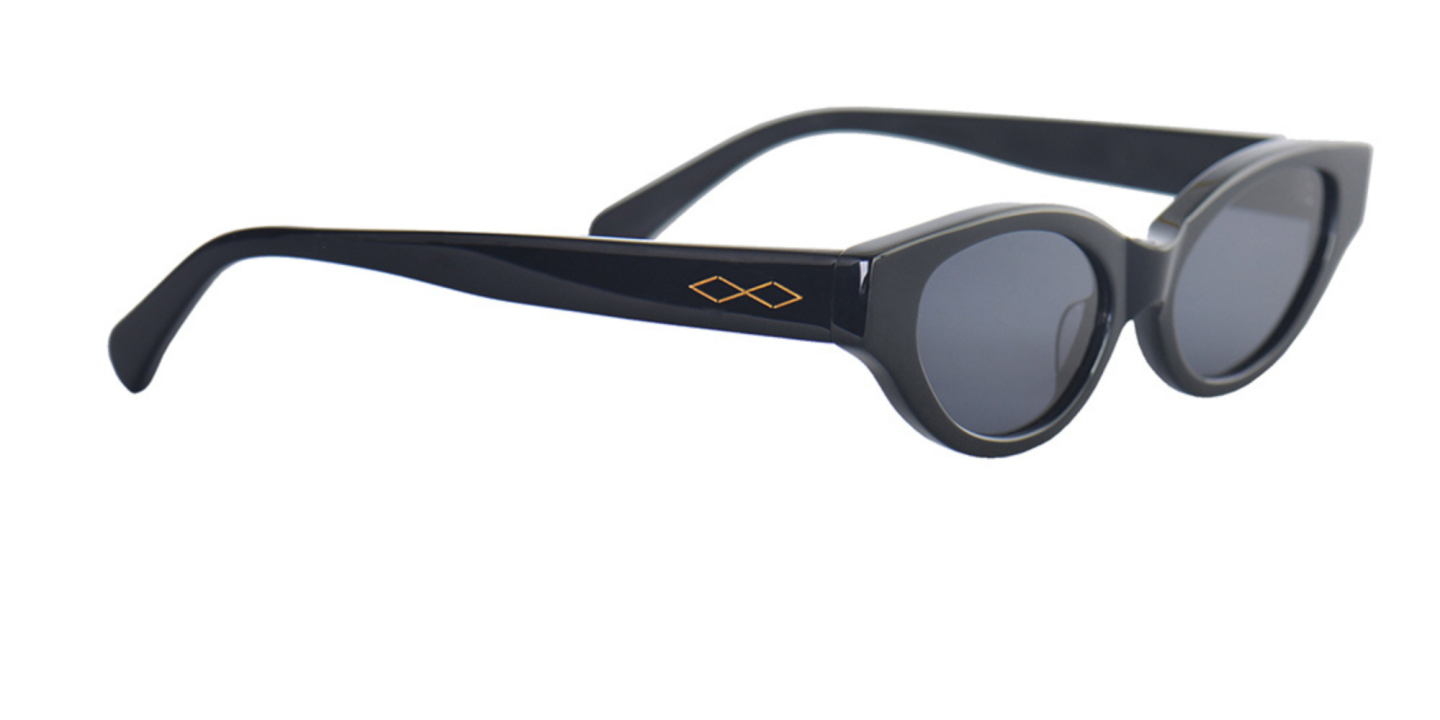 Shop Karen Wazen Glamorous Oval Sunglasses in Black online.
