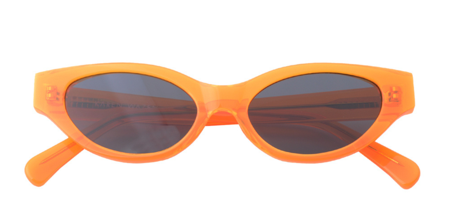 Shop Karen Wazen Glamorous Oval Sunglasses in Orange online.