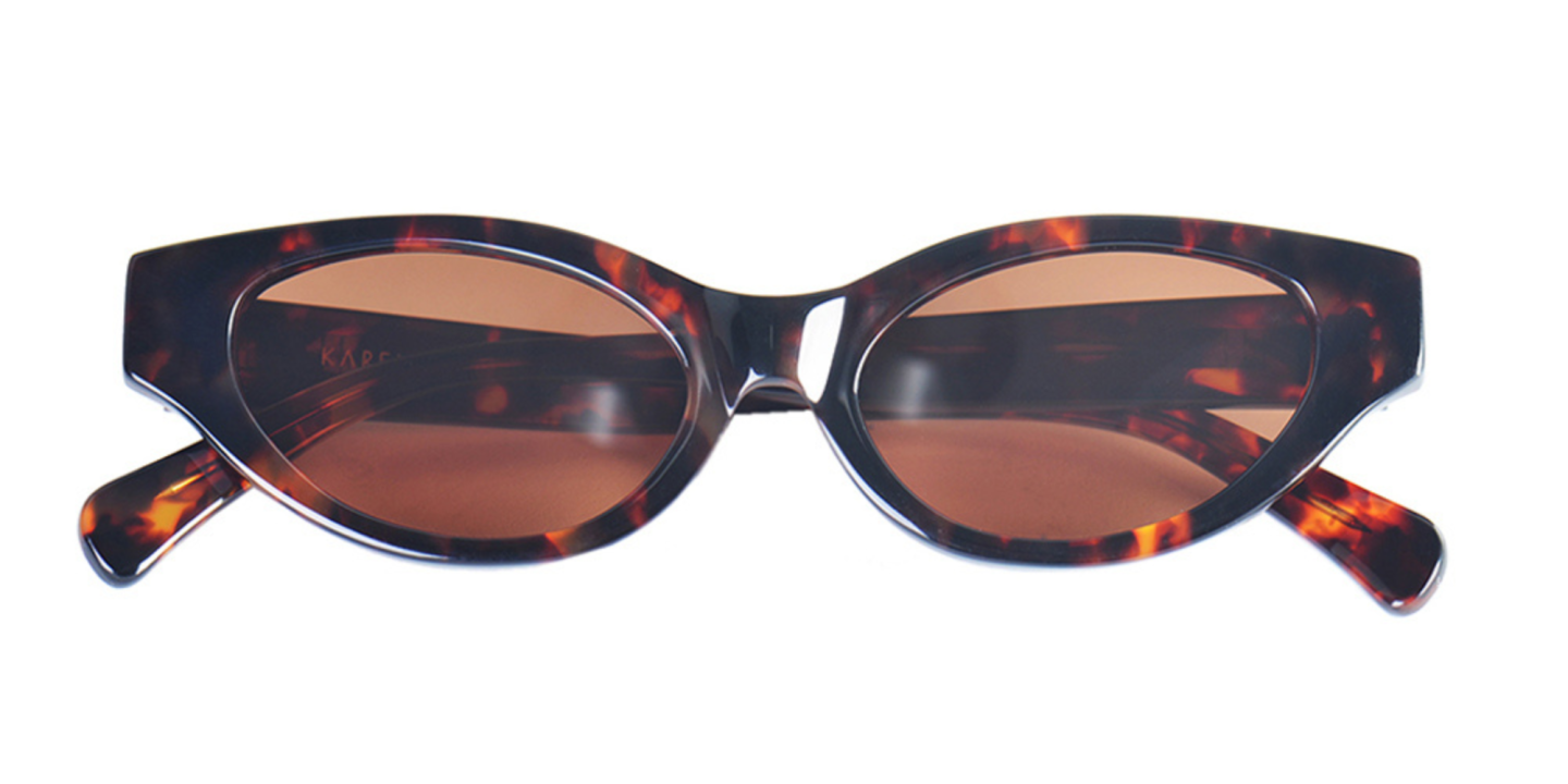 Shop Karen Wazen Glamorous Oval Sunglasses in Tortoise online.