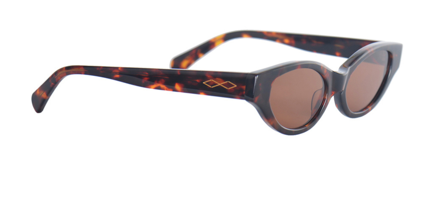 Shop Karen Wazen Glamorous Oval Sunglasses in Tortoise online.