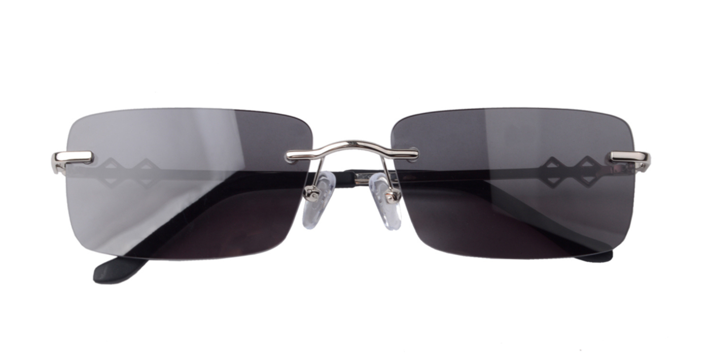 Shop Karen Wazen Layla Rimless Rectangle Sunglasses in Silver online.