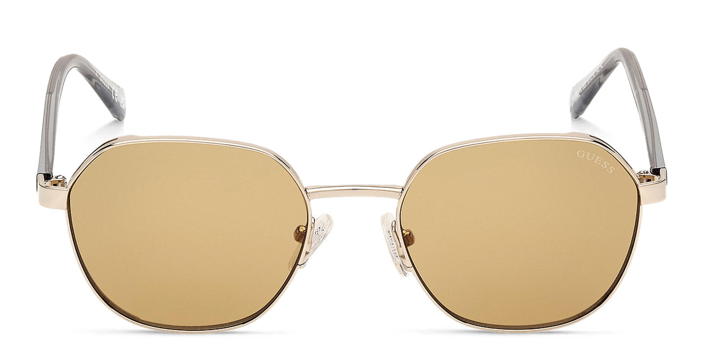 Shop Guess Logo Round Sunglasses in Gold online.