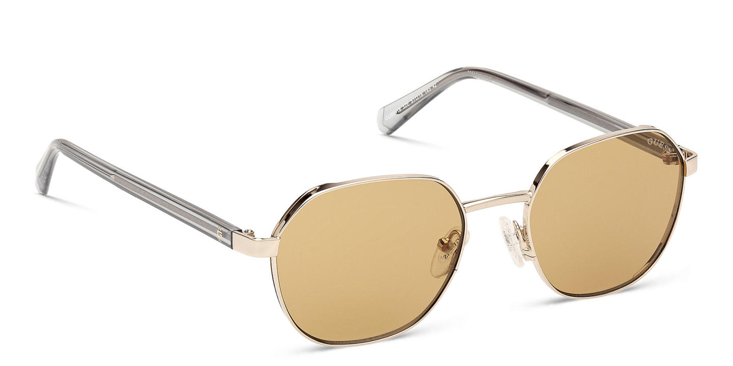 Shop Guess Logo Round Sunglasses in Gold online.