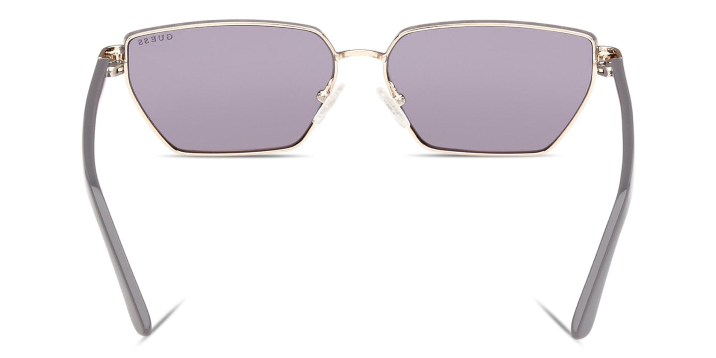 Shop Guess Logo Lettering Irregular Sunglasses in Pale Gold online.