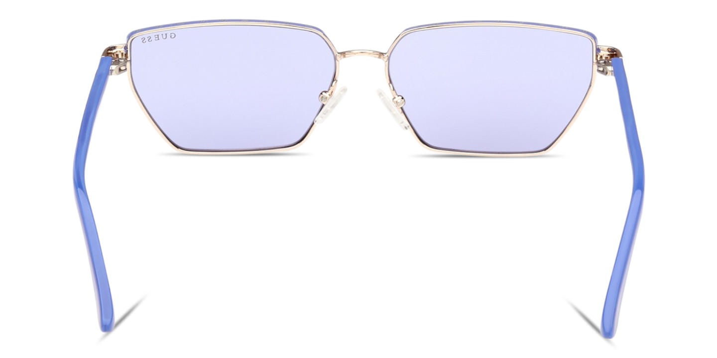 Shop Guess Logo Lettering Irregular Sunglasses in Pale Gold online.