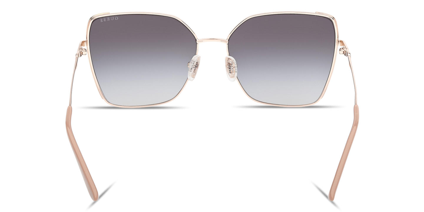 Shop Guess G Logo Butterfly Sunglasses in Gold online.