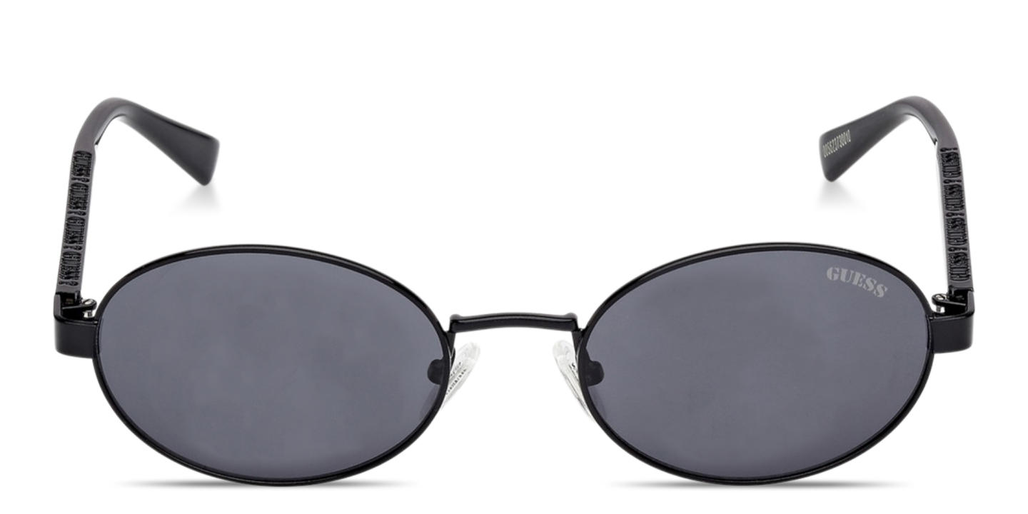 Shop Guess Engraved Logo Unisex Oval Sunglasses in Black online.