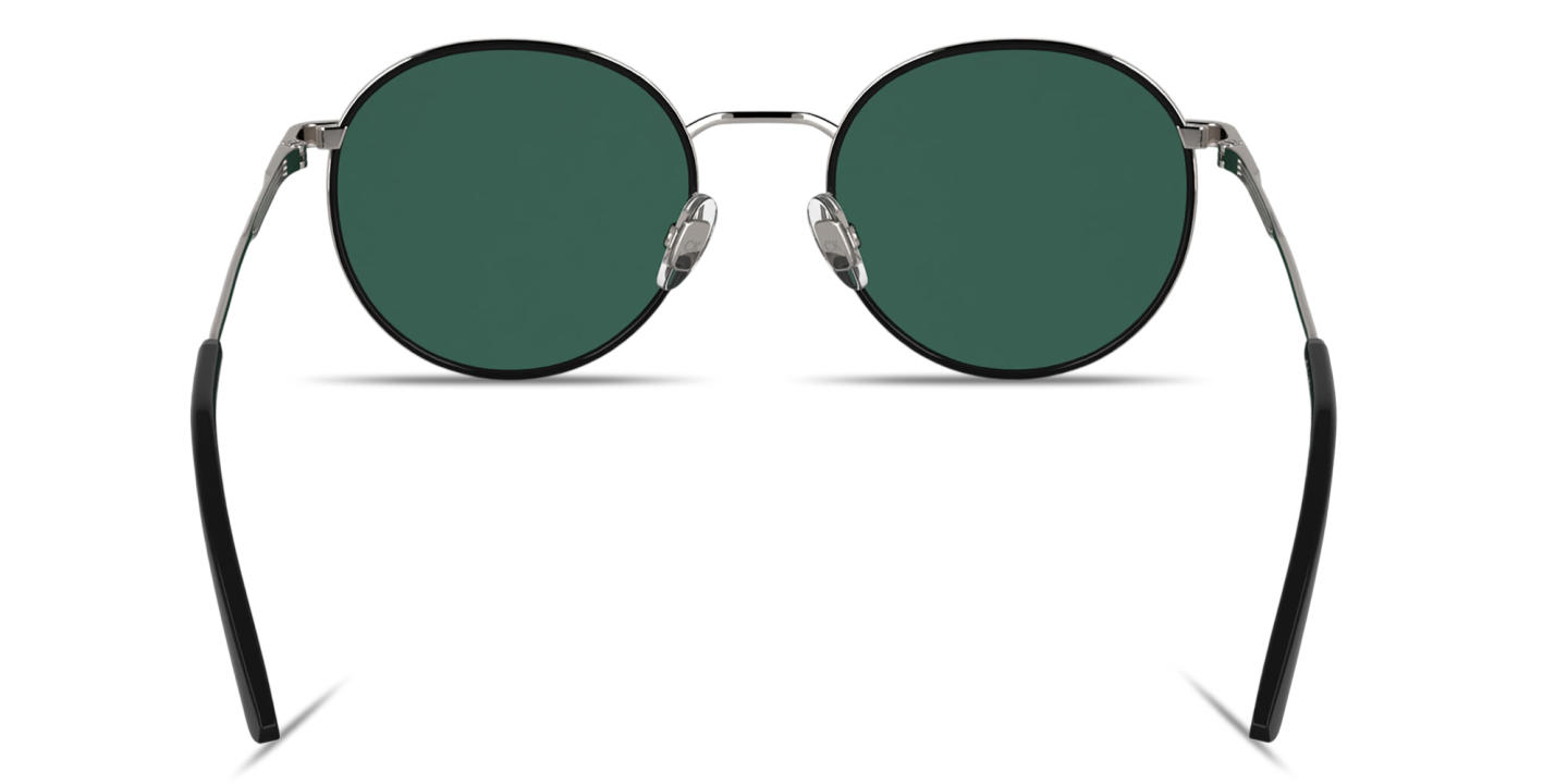 Shop Calvin Klein Engraved Logo Unisex Round Sunglasses in Black & Silver online.