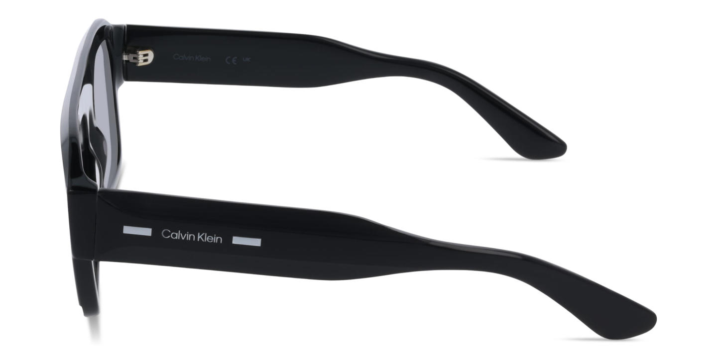 Shop Calvin Klein Logo Lettering Rectangle Sunglasses in Black online.