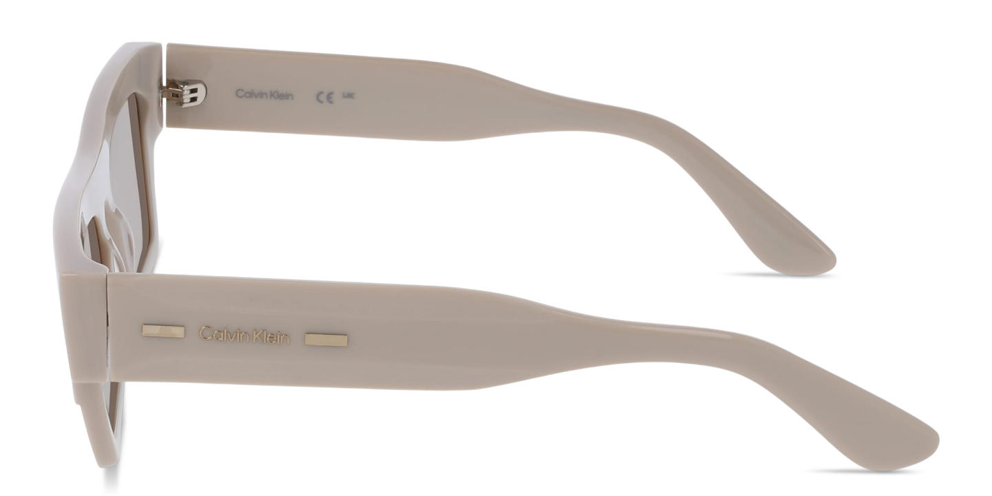 Shop Calvin Klein Logo Lettering Unisex Rectangle Sunglasses in Beige online.