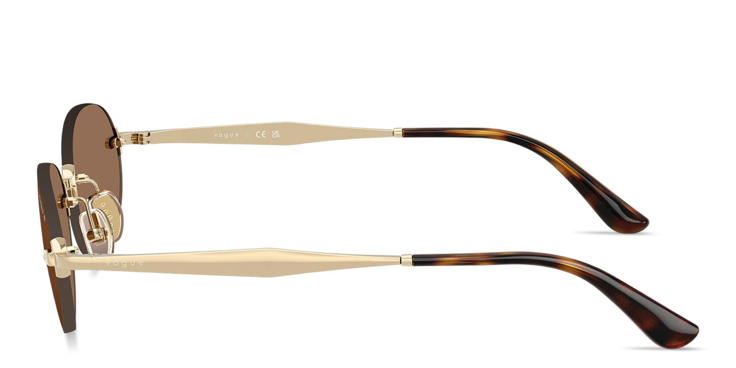 Shop Vogue Eyewear Engraved Logo Rimless Oval Sunglasses in Pale Gold online.