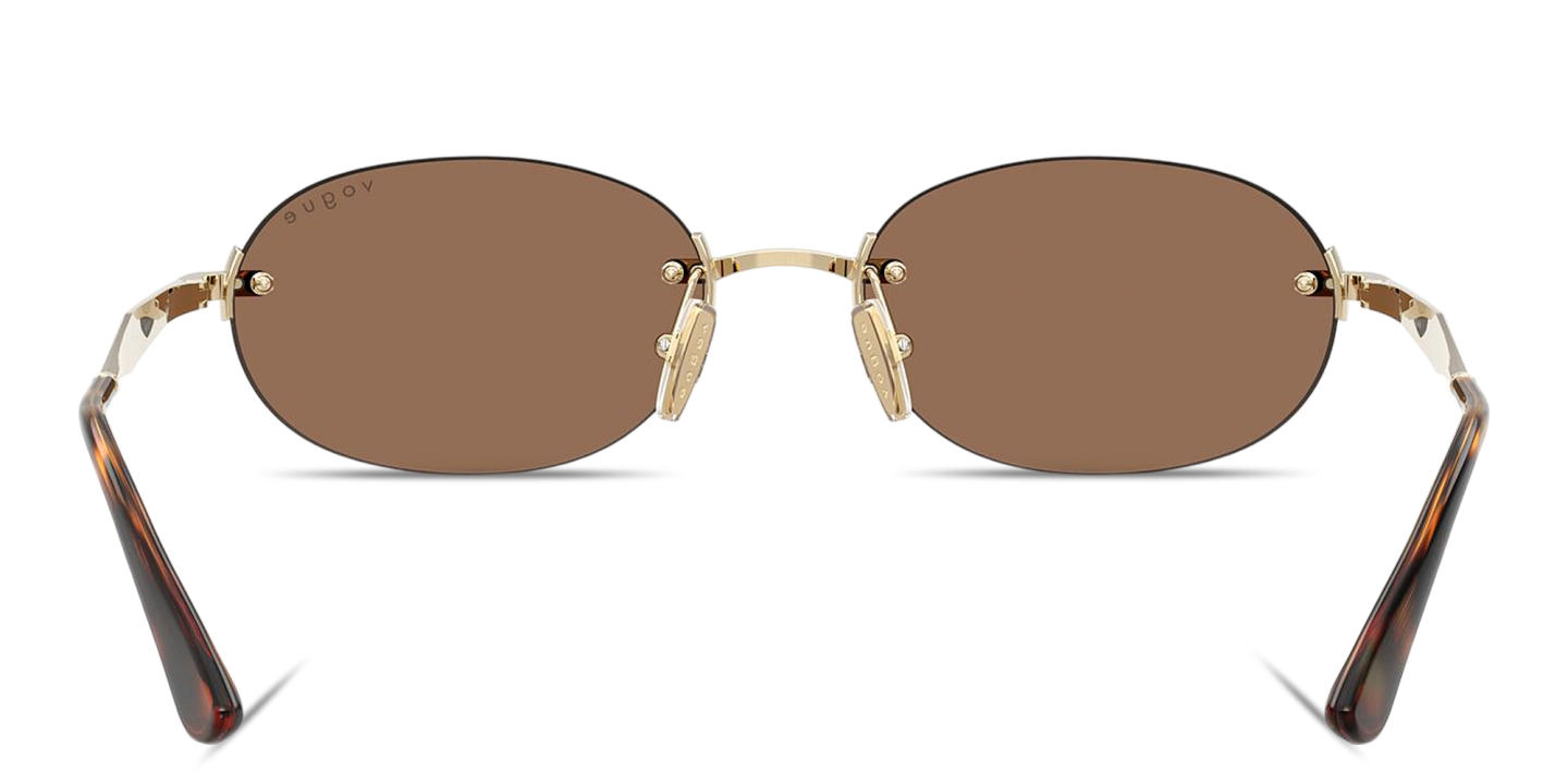 Shop Vogue Eyewear Engraved Logo Rimless Oval Sunglasses in Pale Gold online.