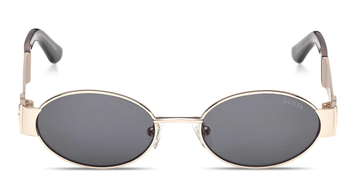 Shop Guess Iris Oval Sunglasses in Gold online.