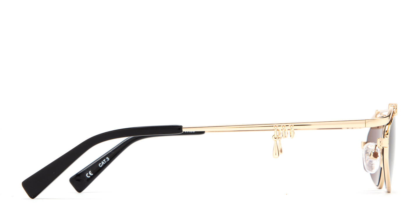 Shop TRICE Nori Irregular Sunglasses in Gold online.