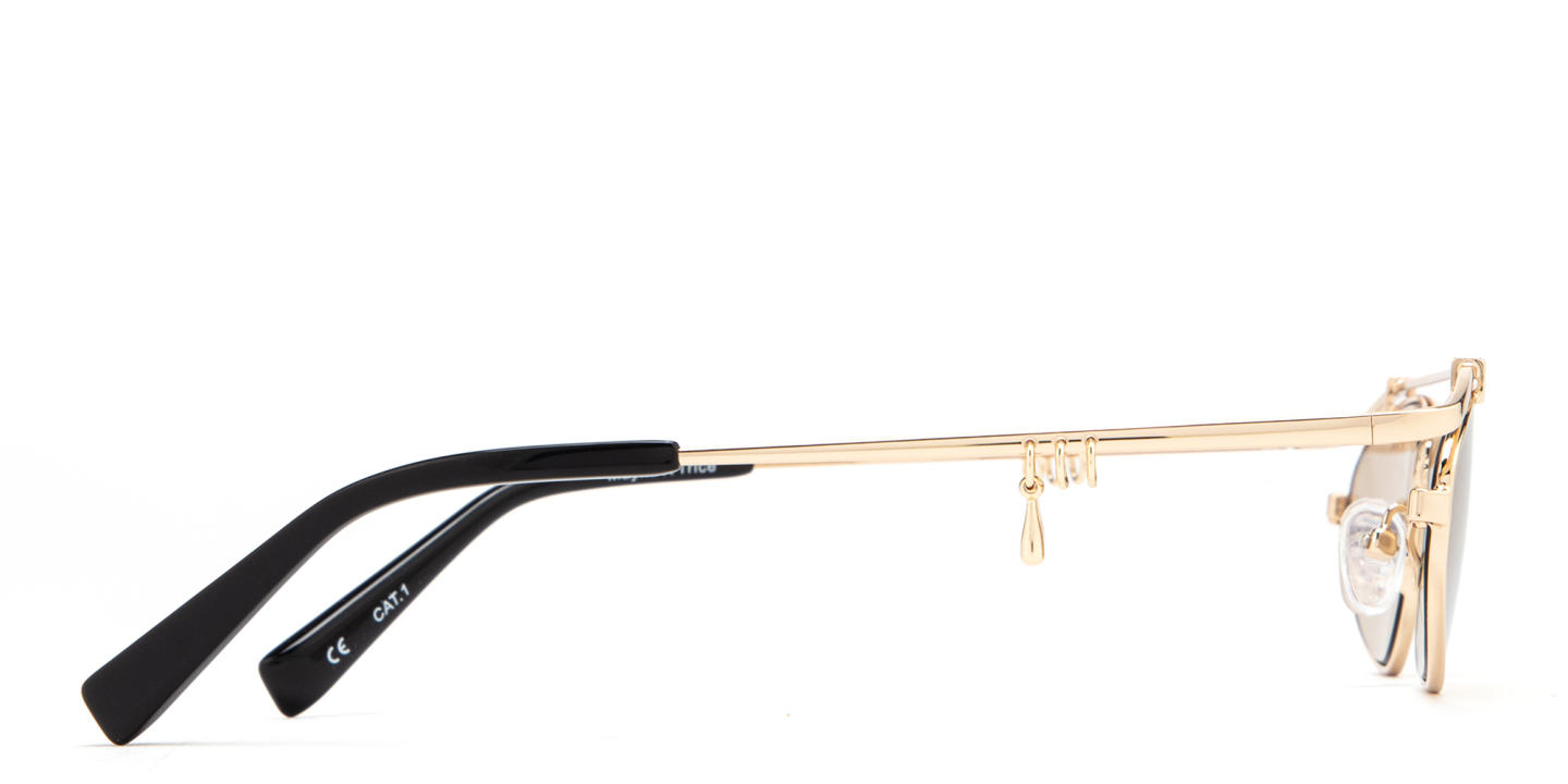 Shop TRICE Nori Irregular Sunglasses in Gold online.