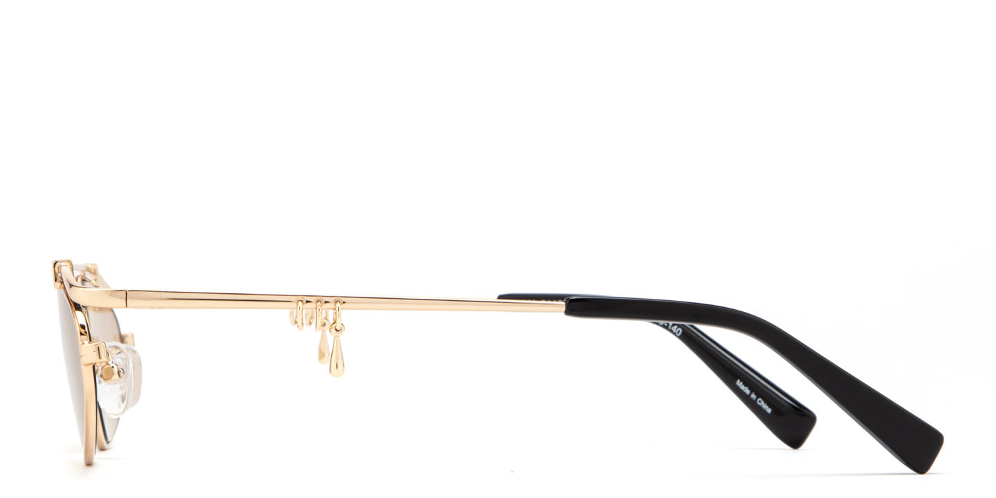 Shop TRICE Nori Irregular Sunglasses in Gold online.
