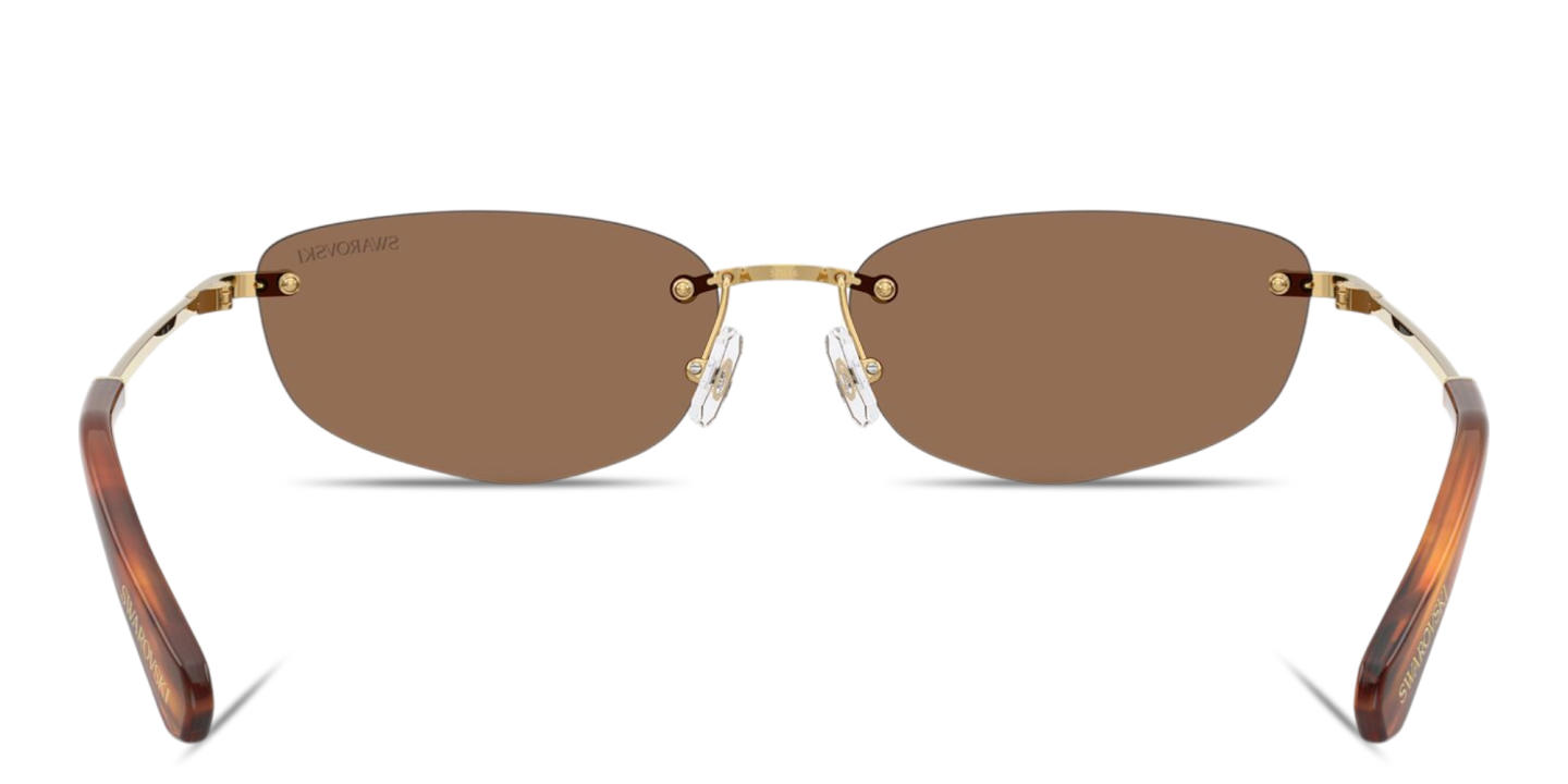 Shop Swarovski Crystal Rimless Irregular Sunglasses in Gold online.