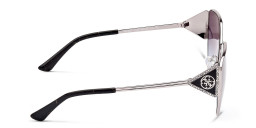 Shop Guess Irregular Sunglasses in Silver online.