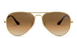 Shop Ray-Ban Pilot Gradient Sunglasses in Gold/Clear Gradient Brown online.
