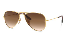 Shop Ray-Ban Junior Kids Pilot Sunglasses in Metal in Polished Gold online.