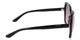 Shop Calvin Klein Oversized Square Sunglasses in Red online.