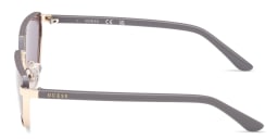 Shop Guess Logo Lettering Irregular Sunglasses in Pale Gold online.